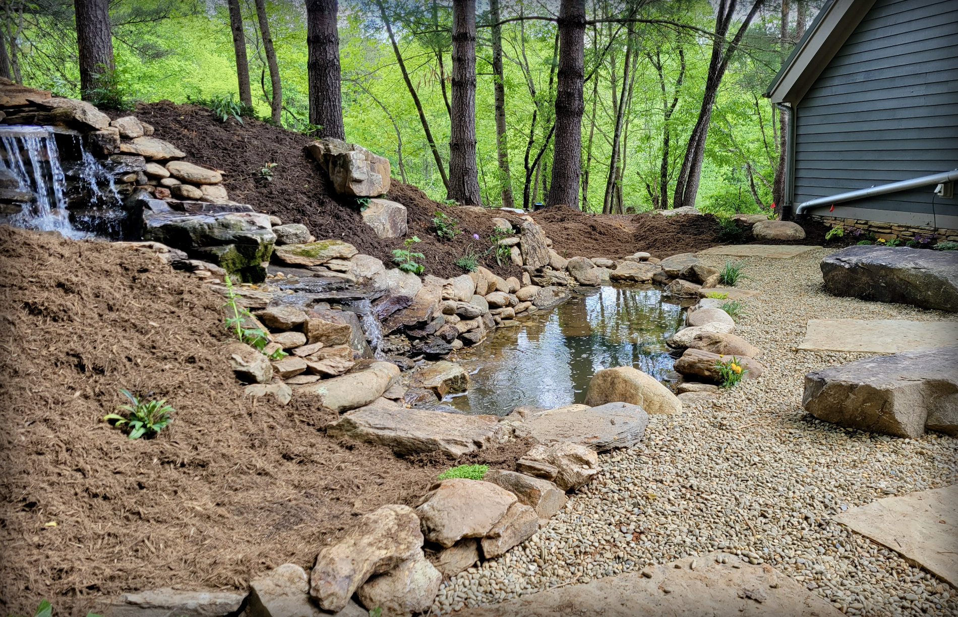 A handbuilt pond with beautiful stonework.